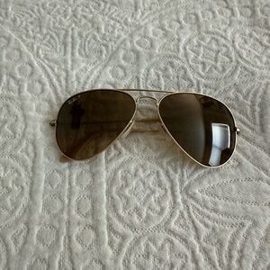 Gold RayBans w/ Case. In good condition, a chip on one lense, shown in pictures